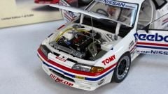 AUTOART - NISSAN - SKYLINE GT-R (R32) TEAM REEBOK N 1 GROUP A 1990 HASEMI - WITH DRIVER FIGURE